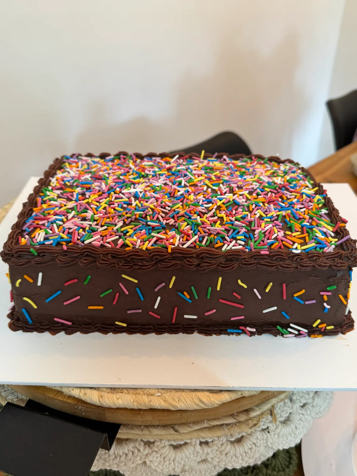 Brigadeiro with a ganache topping and colorful sprinkles